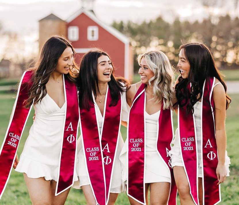 Girls wearing class of 2021 graduation ribbons