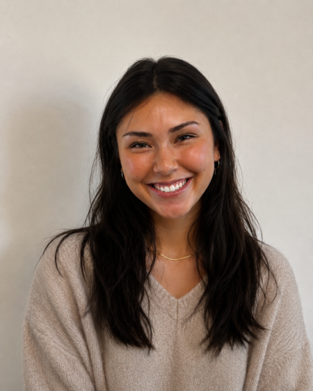 Woman in tan sweater.