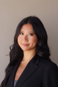 Dark haired woman in black blazer