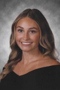 Smiling woman in black drape professional photo